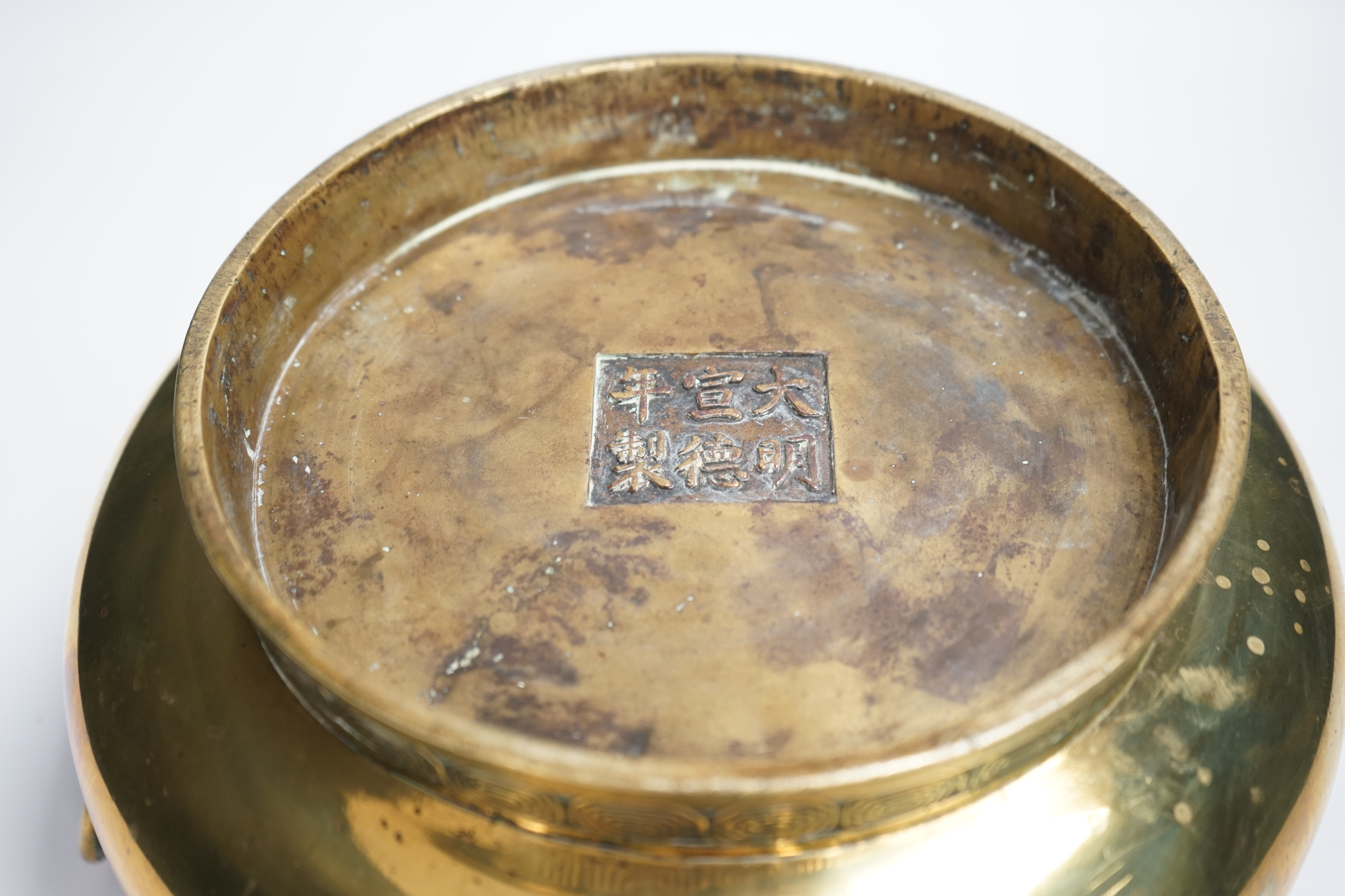 A large Chinese bronze censer, Xuande mark to base, 31cm across